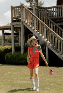 REd Romper with ruffle sleeve at shoulder