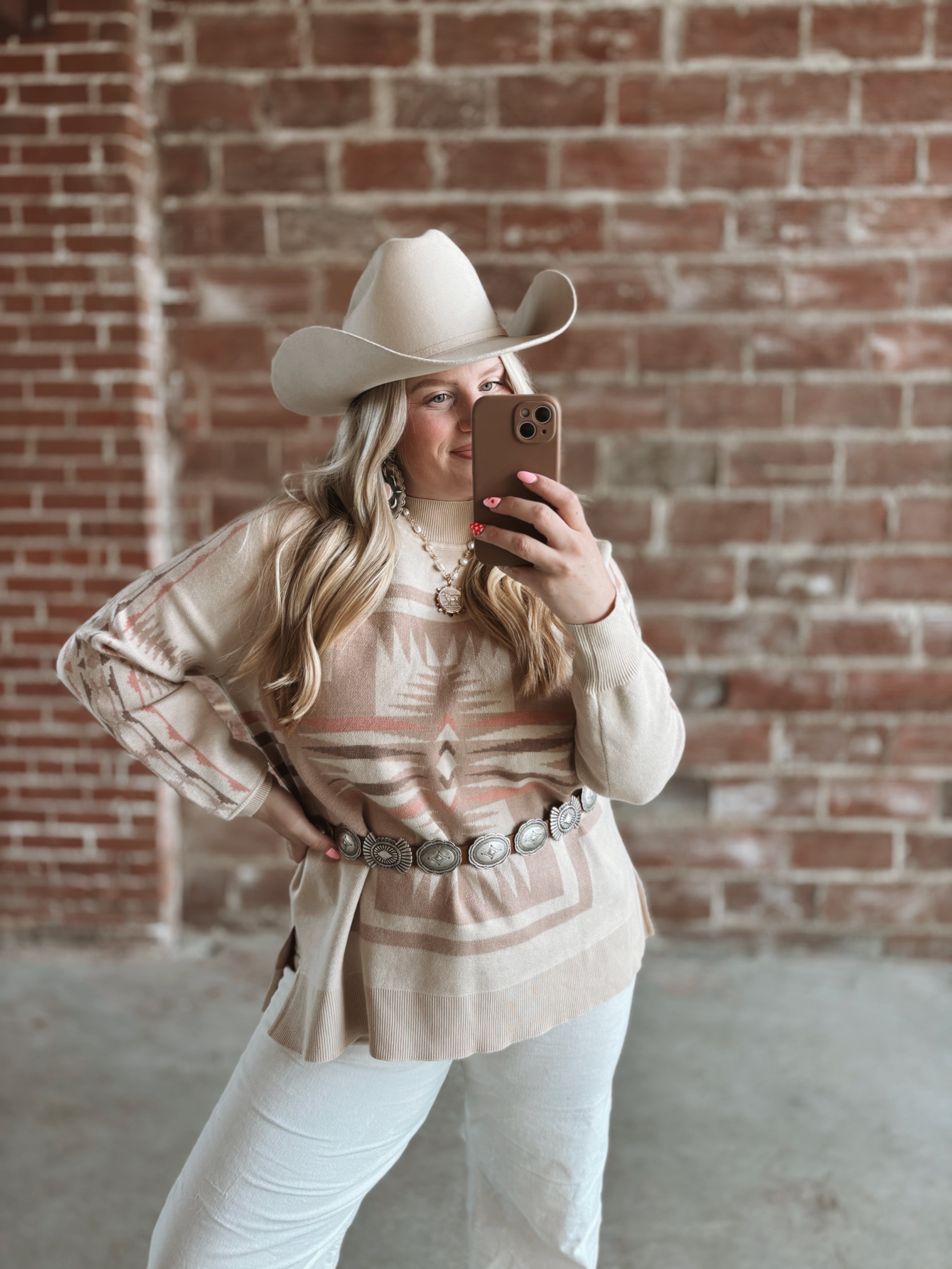 Mock neck cross sweater with slight bubble sleeve in creams, pink, taupes. Soft and cozy 