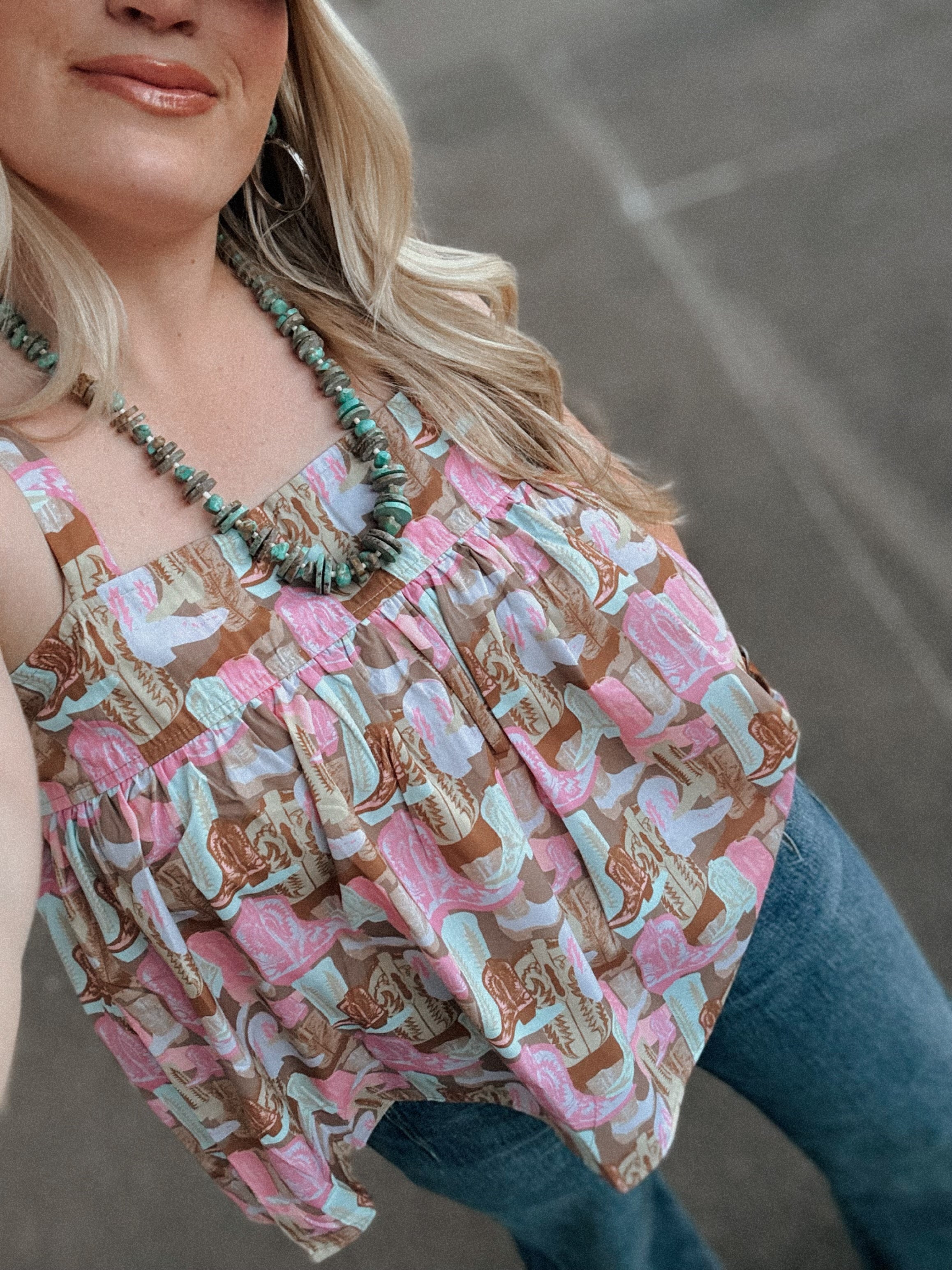 Woman wearing a patterned top with a blurred background