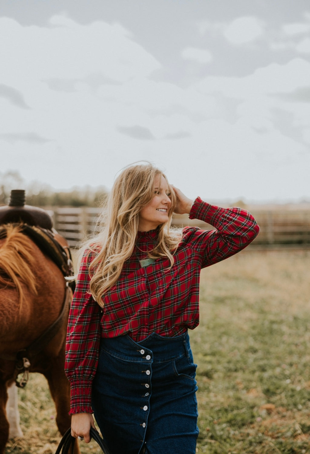 Red Plaid button up blouse with ruffle trim and gathered at wrist.