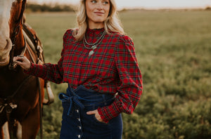 Red Plaid button up blouse with ruffle trim and gathered at wrist.