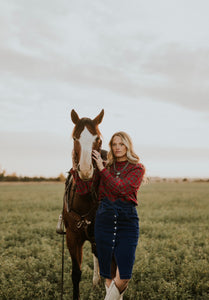 Red Plaid button up blouse with ruffle trim and gathered at wrist.