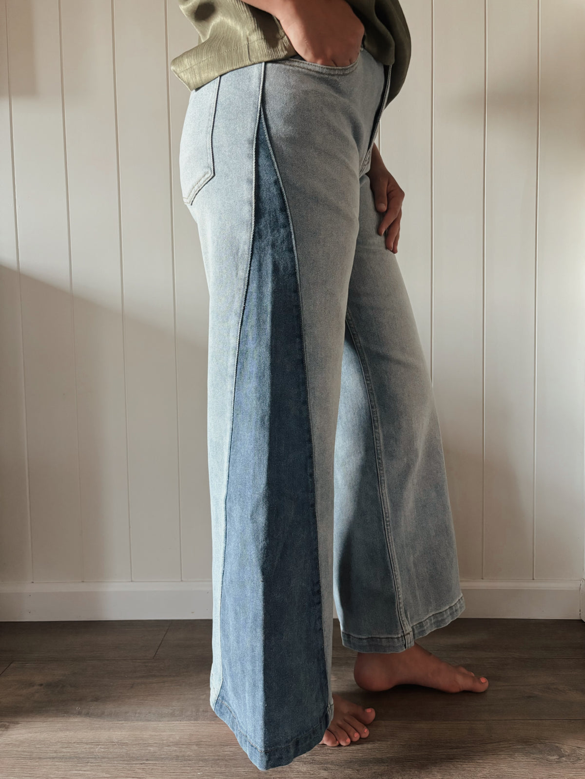 Wide-leg jeans with a darker denim panel down the front