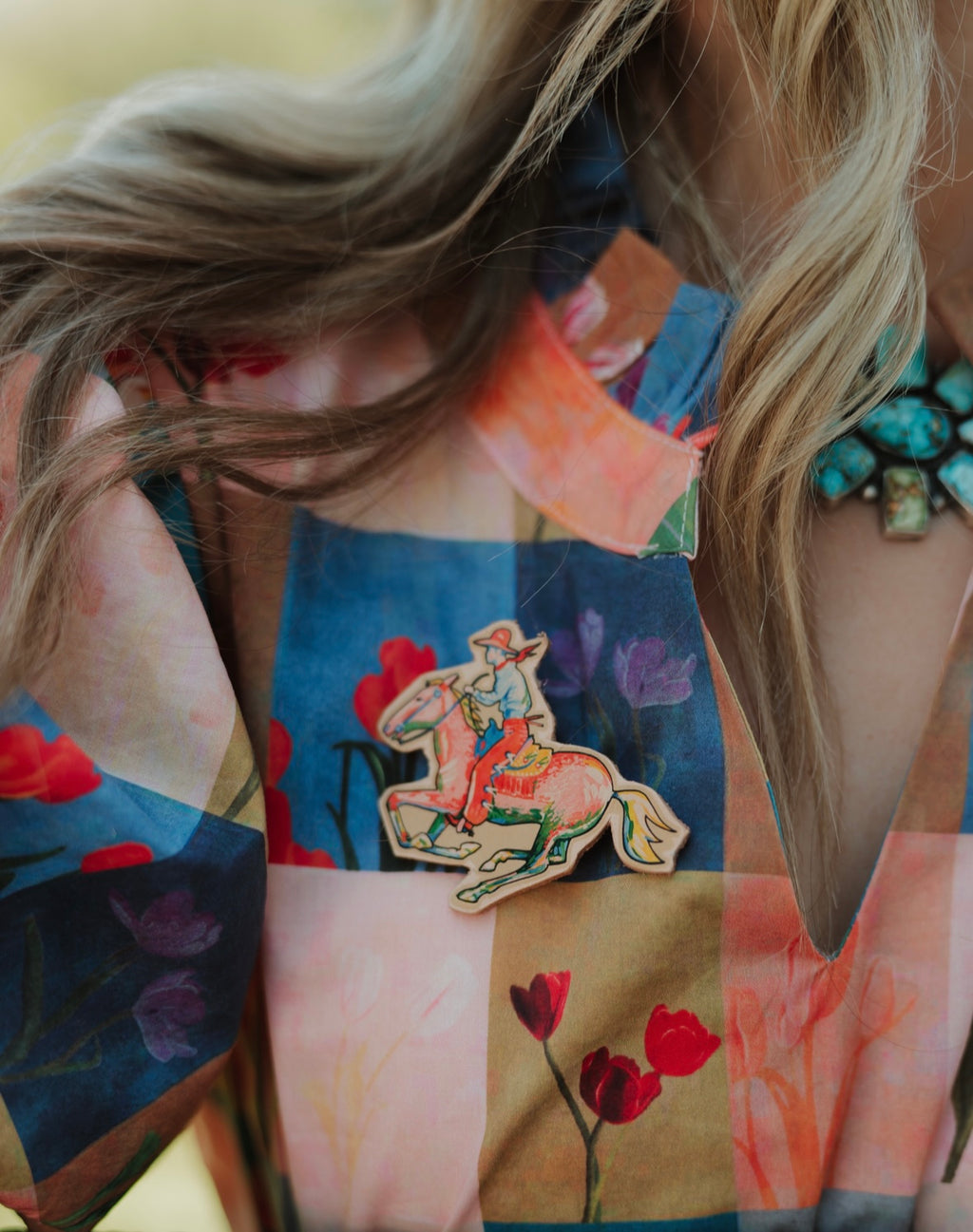 Graphic Pin with woman riding a Wildhorse 