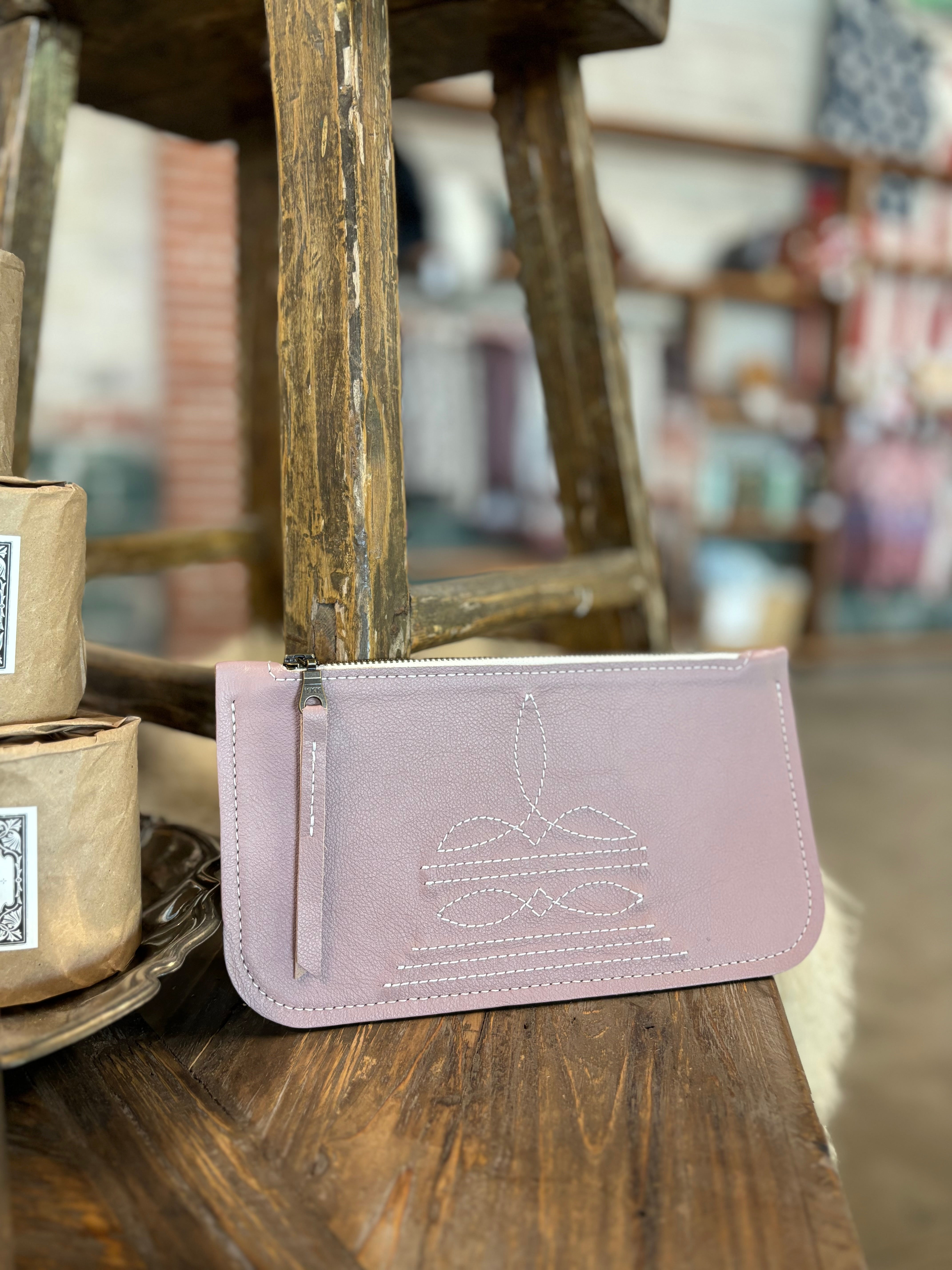 pink leather cowboy stitch clutch