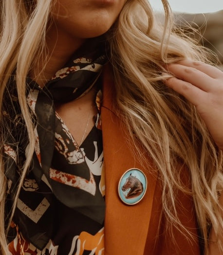 Pin brooch with horse head